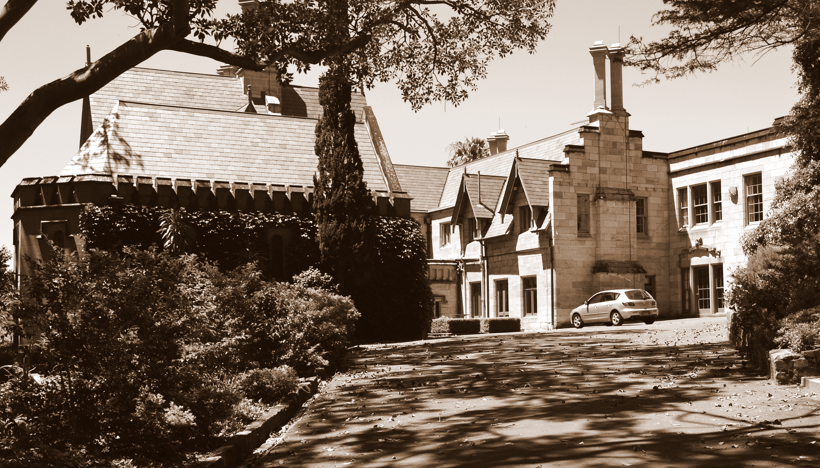 Bishopscourt at 11A Greenoaks Avenue, Darling Point — the Mort estate begun in 1846, expanded by Hilly, Blacket and Wilkinson across a century.