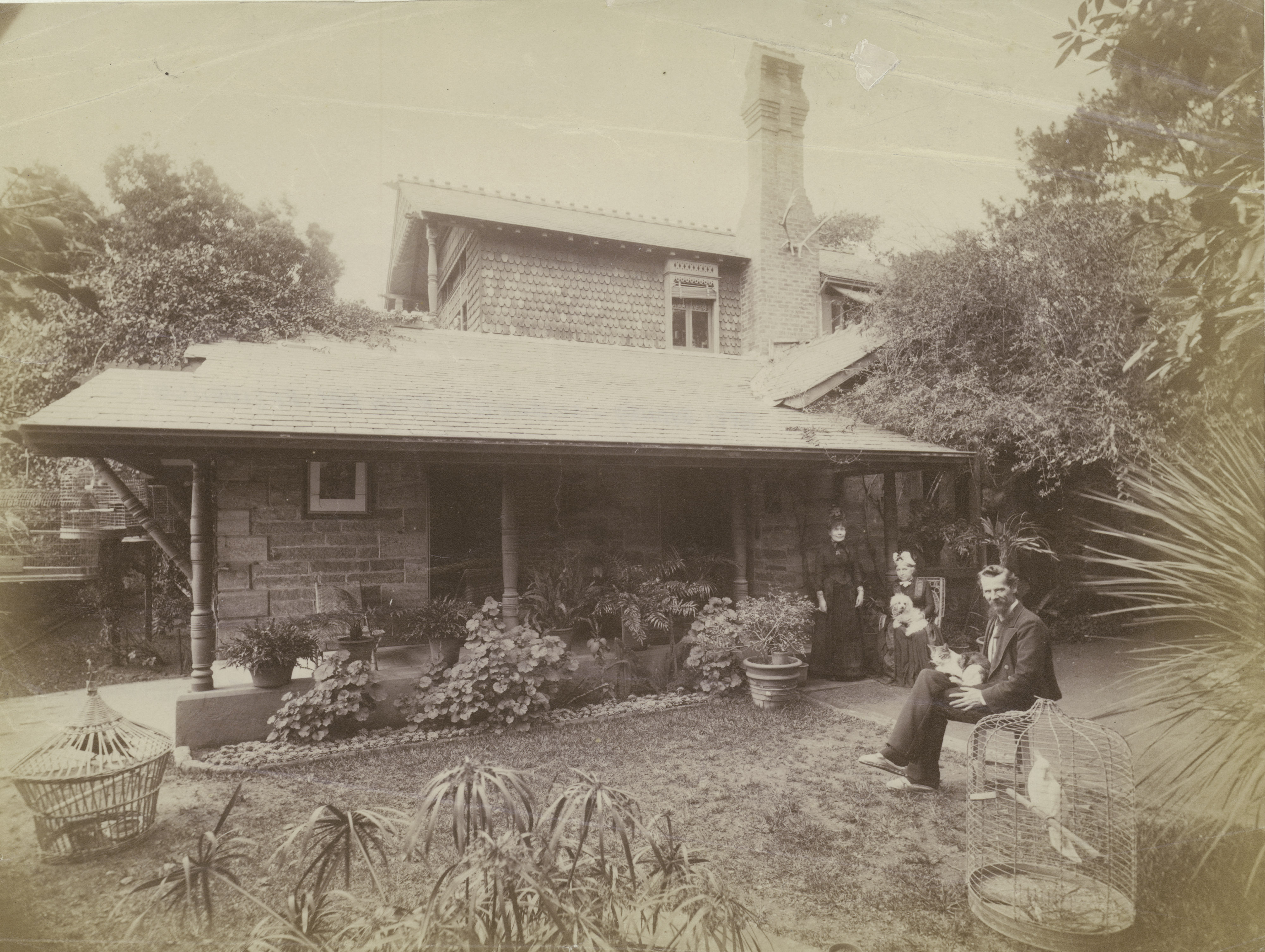 John Horbury Hunt photographed outside Cranbrook Cottage, Bellevue Hill, c.1889.